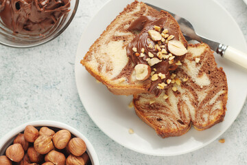 Wall Mural - A piece of marble biscuit with chocolate cream and nuts	