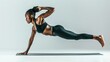 © ENJOINZ - A fitness enthusiast performing a perfect plank on a white background, showcasing core strength and stability.