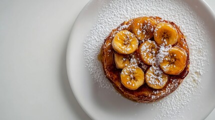 Poster - Honey toast topped with caramelized bananas and a sprinkle of powdered sugar, shot from above on a white background.