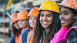 © Jang - Group of several happy women doing construction work at construction site