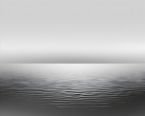 Wall Mural - A calm body of water with a gray sky in the background