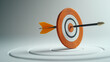 © Alena - Clean white backdrop with arrow hitting target, symbolizing business success.