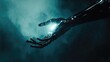 © Nijieimu - A hand holding a glowing object in a dark room