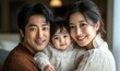 © Kevin - Portrait of a Korean family with parents and their young toddler kid at happy home, Generative AI