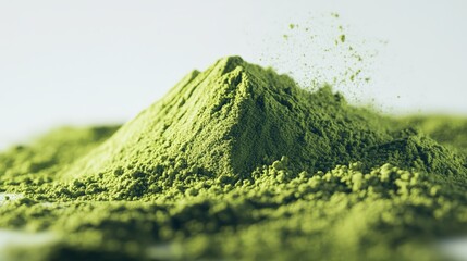 Macro low-angle of a vivid green matcha powder mound, white backdrop, detailed focus, soft natural light.