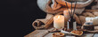 © ArtSys - Home comfort, coziness, aromatherapy. Cozy interior with knitting, burning candles and aroma perfume diffuser in the living room. Fall scent, sweet pumpkin pie fragrance dry leaves, autumn mood banner