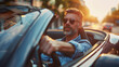 © Q77photo - A man in a car with sunglasses on and a beard