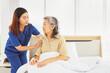 © ฺฺฺBoonterm - Female doctor nurse take care elderly female patient who is being treated for discomfort due congenital disease gently supporting her shoulder to help her sleep : Elderly health insurance.