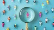 © Kunut - Finding the Perfect Candidate: A magnifying glass focuses on a miniature woman surrounded by a diverse crowd, symbolizing the search for talent in a competitive job market.