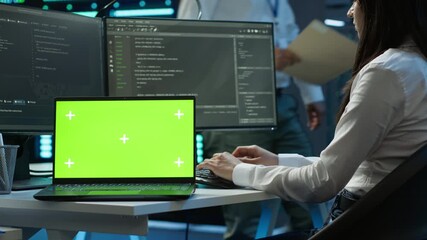 Poster - programmer in data center managing and maintaining databases using chroma key notebook, ensuring dat