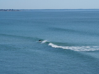 solitary surfer in coastal Maine