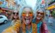 © Igal - Three senior women take a playful selfie on the city street, sticking out their tongues and showing rock 'n' roll hand gestures, capturing their fun-loving friendship.