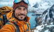 © Igal - A cheerful climber is taking a selfie with a smart mobile phone while hiking in the mountains, highlighting the travel and action camera aspects.