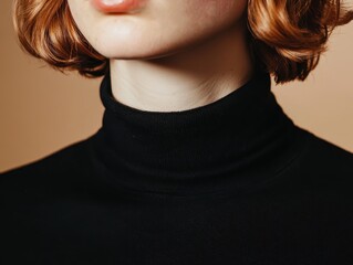 Close-up shot of a woman's neck in a black turtleneck sweater, highlighting smooth skin and stylish elegance with short red hair.
