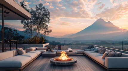 Wall Mural - A luxurious terrace lounge with a chic fire pit, cozy sectional sofas, and a breathtaking view of a mountain range at sunrise.