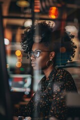 Wall Mural - Dark women use the concept of digital technology in the office, demonstrating their excellent performance and advanced technological insight in the workplace. 