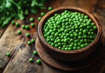 Wall Mural - A bowl of green peas is on a wooden table