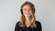 © ELENA AI - A smiling female telecom operator with a headset provides professional support in a modern office, isolated against a white background.