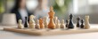 © Naphatson - Chess pieces on a board, with the white king in the center.