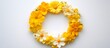 © Lucky Ai - Wreath of assorted yellow flowers on white background Spring and summer symbol with room for text Overhead view