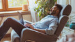 © VK Studio - A relaxed man reclines in a comfortable chair, enjoying a moment with his laptop in a bright, cozy room filled with plants.