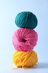 Poster - Stack of colorful yarns on light background