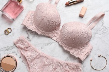 Sticker - Beautiful lace lingerie set and accessories on light marble background