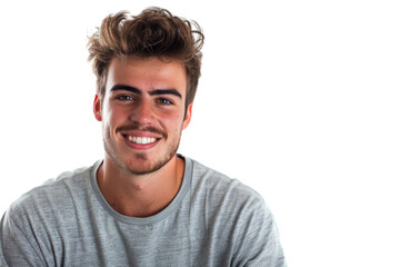 Wall Mural - Smiling young man in casuals, standing confidently, isolated on white background