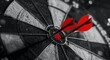 © Ekkarat_Studio - Two red darts hit the center of the target, success goal concept