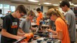 © amorn_m - Kids working on a robot project in a classroom.