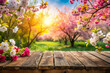© Sirinporn - Vibrant cherry blossoms adorn a weathered wooden table top, set against a stunning backdrop of a blooming spring garden, bursting with colorful flowers and lush greenery.