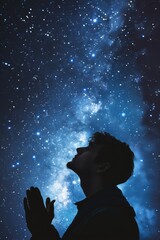 Wall Mural - a man is praying in the sky, surrounded by stars. concept of wonder and awe at the vastness of the u