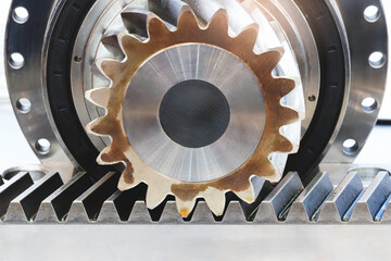 Poster - A gear is shown with a ball bearing in the center. The gear is part of a machine and is turning. ndustrial background concept