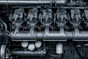 Poster - Large industrial diesel engine or diesel generator close-up with many pipes and other parts. Industrial concept background
