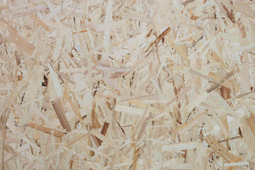 Poster - A pile of wood chips with a brownish color. The pile is made up of wood pieces that are cut into small pieces