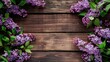 © TheWaterMeloonProjec - Lilac flowers on wooden background flat lay floral arrangement with space for text
