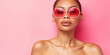© IndigoElf - Young naive woman in rose-colored glasses on colored background with copy space. Creative concept of female gullibility