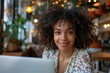 © Kevin - Happy businesswoman working remotely on laptop in a cozy cafe, Generative AI