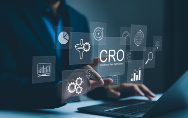 Wall Mural - cro, conversion rate optimization technology concept. a person works on a laptop with cro related te