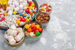© Heksito - front close view candy composition different colored candies with marshmallow on white desk sugar candy bonbon sweet confiture