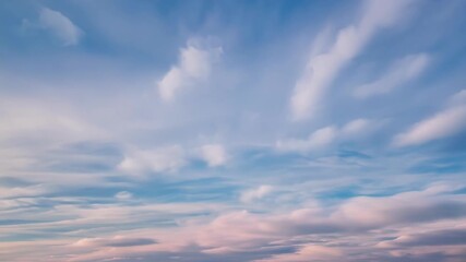 Canvas Print - The sky is dotted with soft cirrus clouds their feathery edges catching the light and creating a dreamy atmosphere.