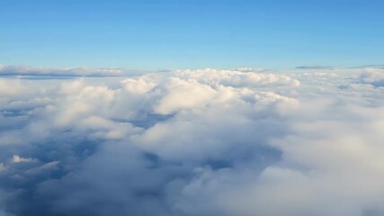 Sticker - High above soft cirrus clouds form a textured blanket of white against a tranquil blue sky.