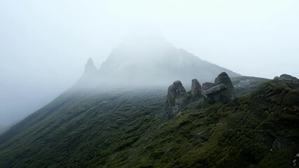 Sticker - The tranquil silence of the mistcovered summit shrouded in a veil of ethereal fog.