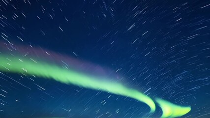 Wall Mural - amidst a cool starstudded night the sky comes alive with a captivating display of undulating crimson