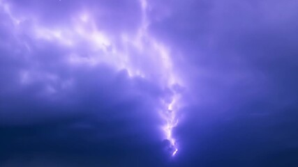 Wall Mural - as a storm rages in the distance mystical flares light up the sky casting an otherworldly glow over 