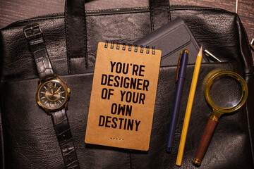 you're designer of your own destiny word under torn black sugar paper.