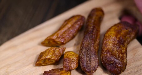 Wall Mural - dried small bananas on a wooden board, several dried banana fruits