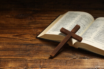 Wall Mural - Bible and cross on wooden table, closeup with space for text. Religion of Christianity