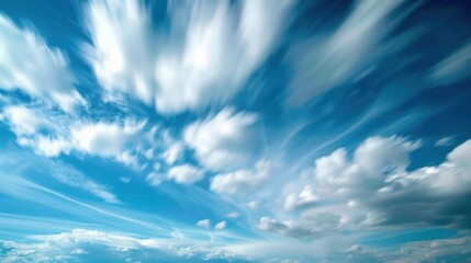 Sky is bright blue with some clouds.