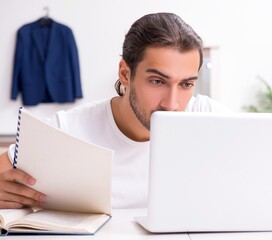 Sticker - Young male student preparing for exams at home